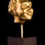 FAUN - Tilmann Krumrey, 2006 FAUN – fine gold 999, 120g, from series of grotesque heads 3.4 cm x 2.4 cm x 3.1 cm, height with plinth (ebony) 11.2 cm